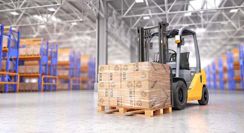 Close up of warehouse and forklift with load of boxes on palette